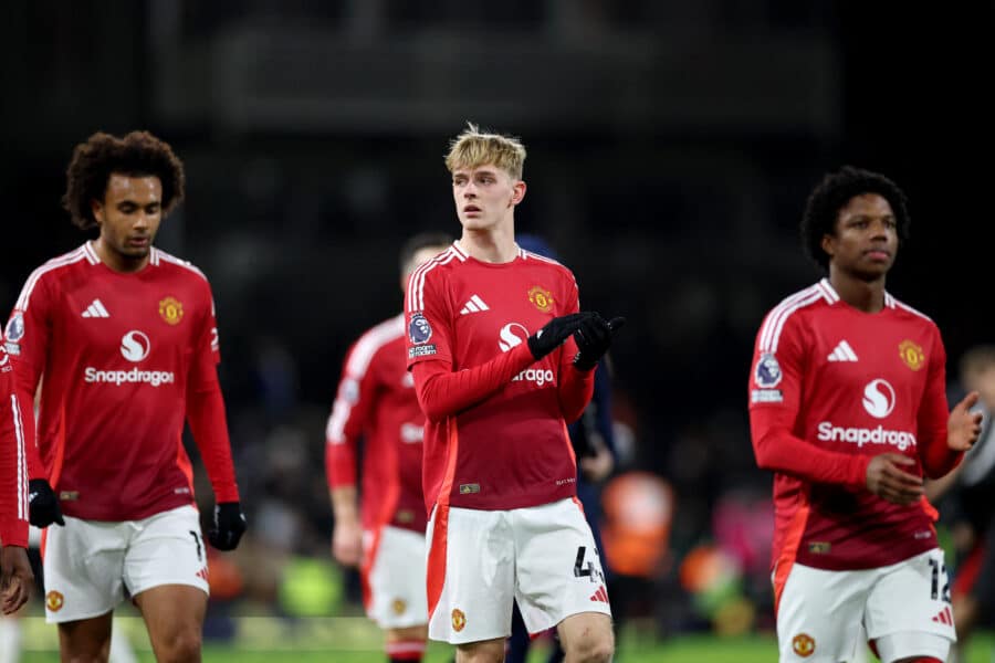 Manchester United's Toby Collyer, Manchester United's Tyrell Malacia and Manchester United's Joshua Zirkzee celebrate after the match