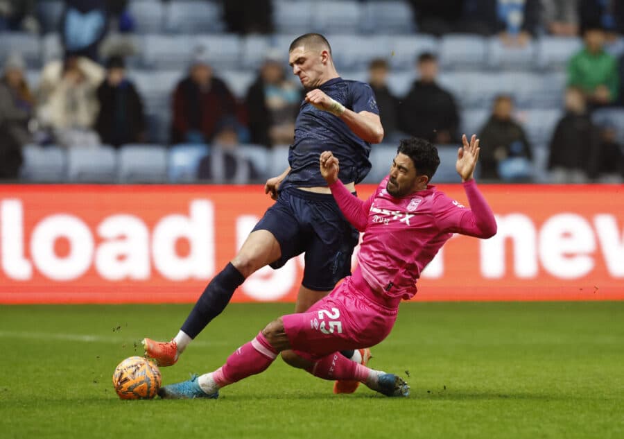 Coventry City man Bobby Thomas is tackled by former Ipswich Town midfielder Massimo Luongo