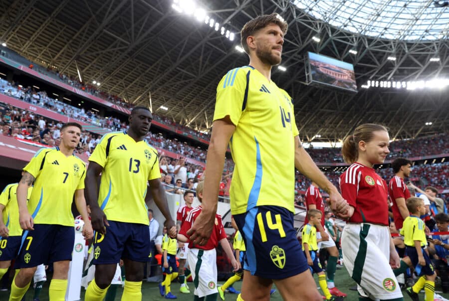 Sweden's Anton Saletros, Ken Sema and Emil Holm are running into the field for the game