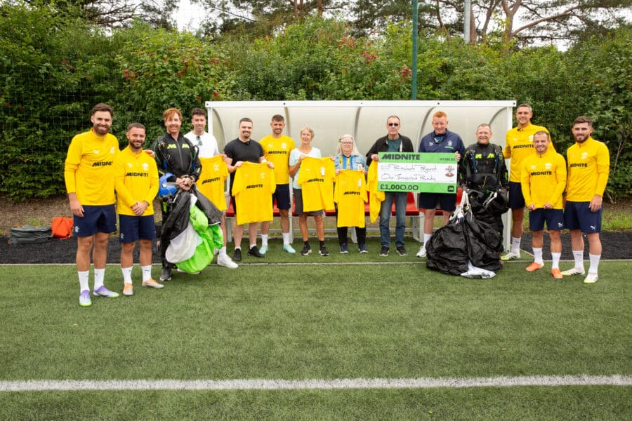 Southampton players and fans with sponsors, Midnite