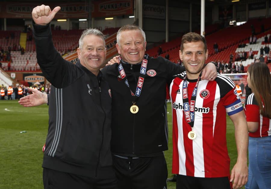 Sheffield United manager Chris Wilder and Billy Sharp celebrate promotion and winning the league after the match