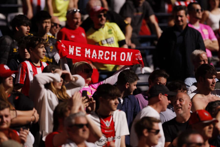 Southampton fans hold up a scarf after the match