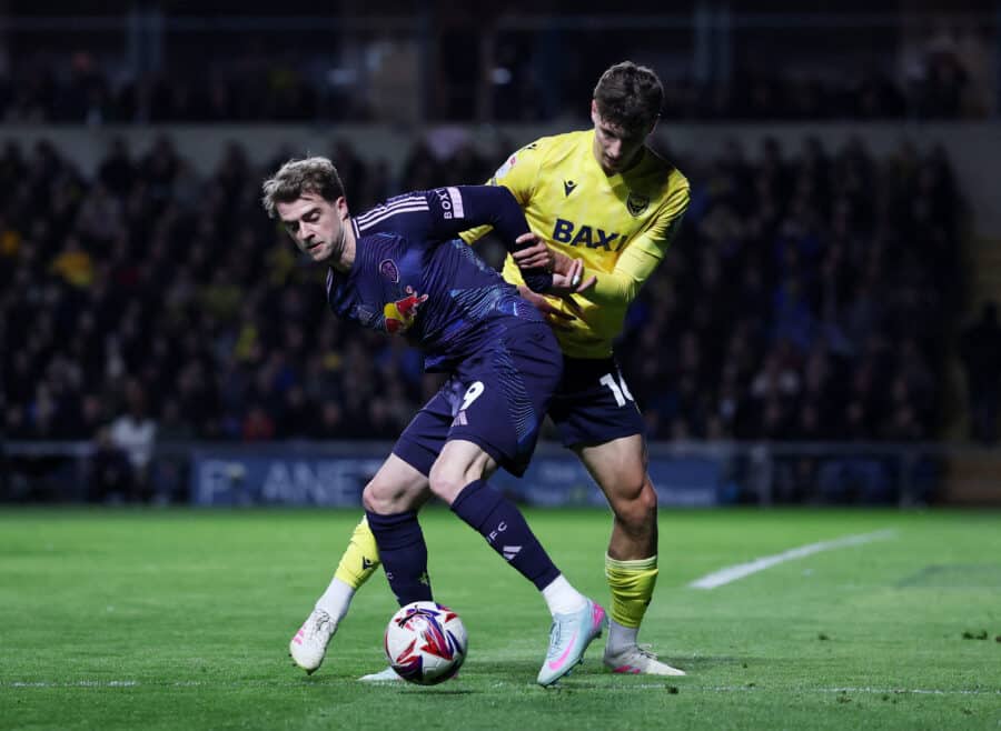 Patrick Bamford of Leeds United in action with Ben Nelson of Oxford United