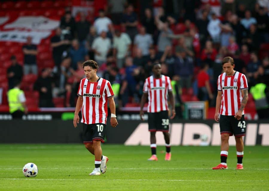 Sheffield United's Callum O'Hare and Sydie Peck look dejected after Bristol City's Scott Twine scores their fourth goal