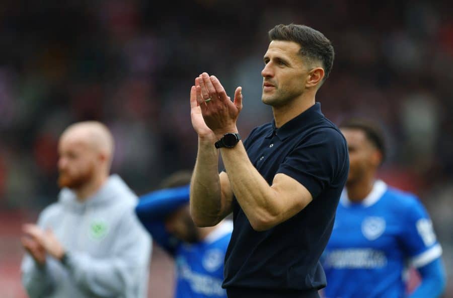 Portsmouth manager John Mousinho applauds fans after the match