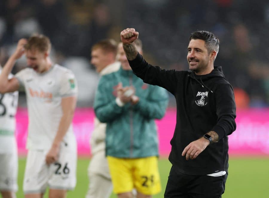 Swansea City manager Alan Sheehan celebrates after the match