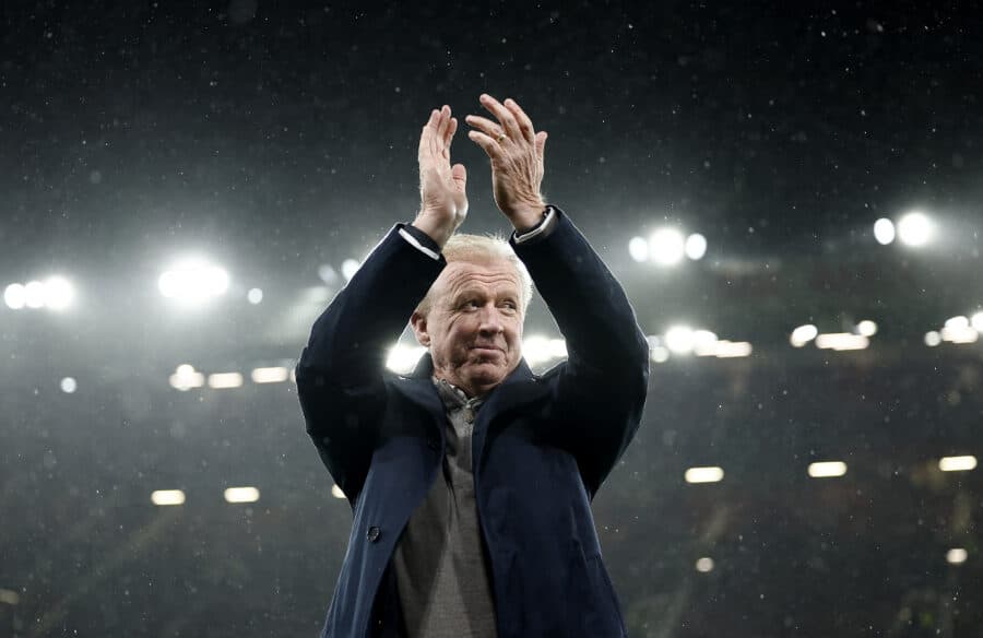 Former Manchester United coach Steve McClaren applauds fans on the pitch after he receives an award for his service at Manchester United before the match