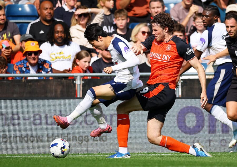 Tottenham Hotspur's Yang Min-hyeok in action with Luton Town's Tom Holmes