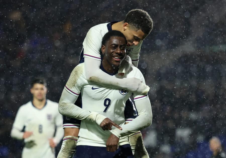 England's Divin Mubama celebrates scoring their first goal with England's Rico Lewis