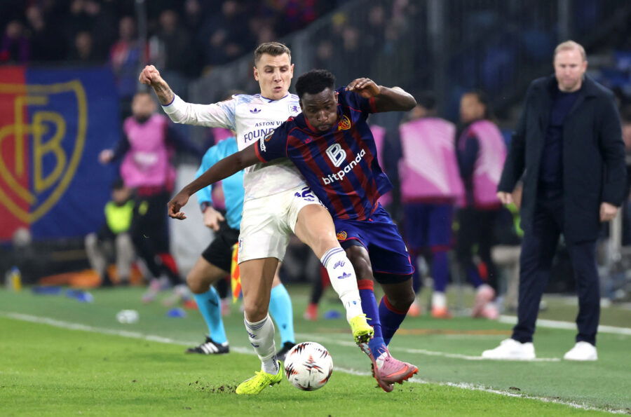 Aston Villa's Lucas Digne in action with Basel's Philip Otele